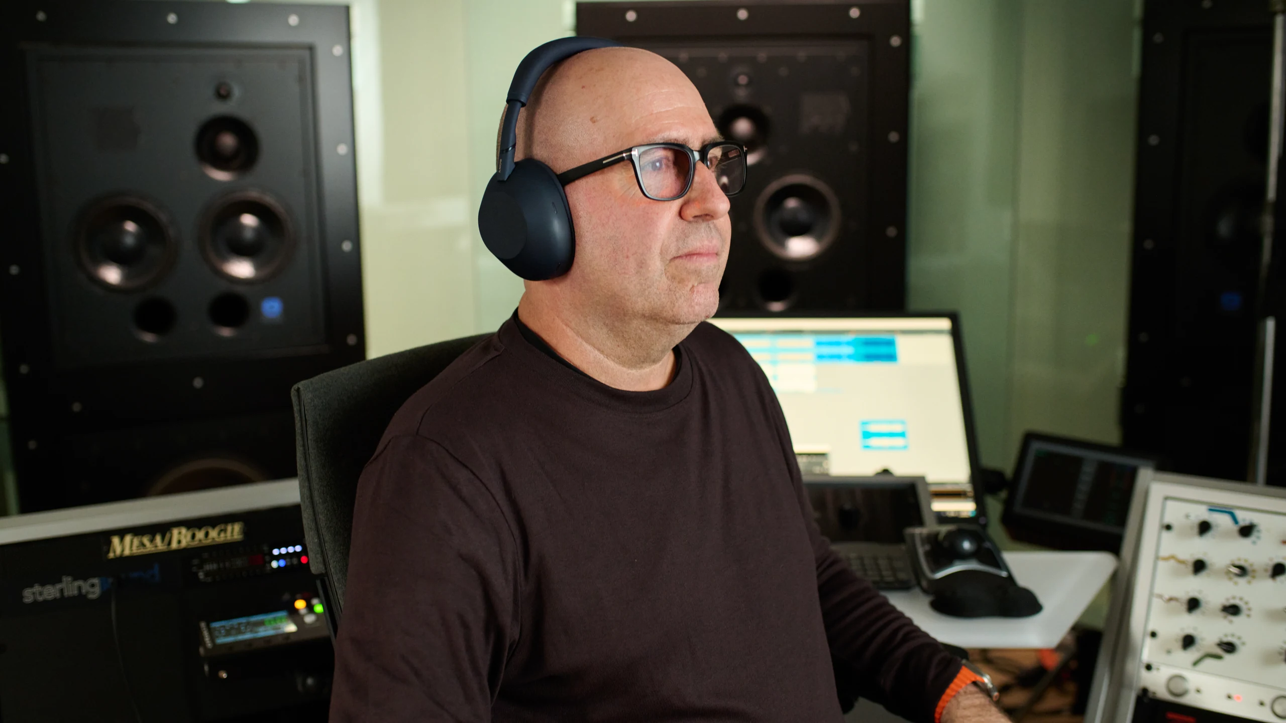 Mastering engineer Chris Gehringer wearing WH-1000XM6 headphones in a studio
